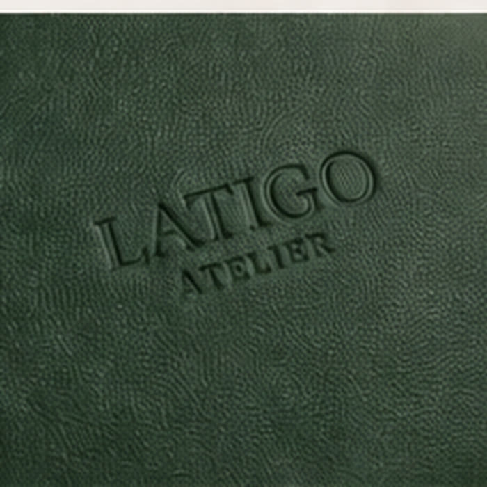 Embossed Latigo Atelier mark on forest green vegan leather
