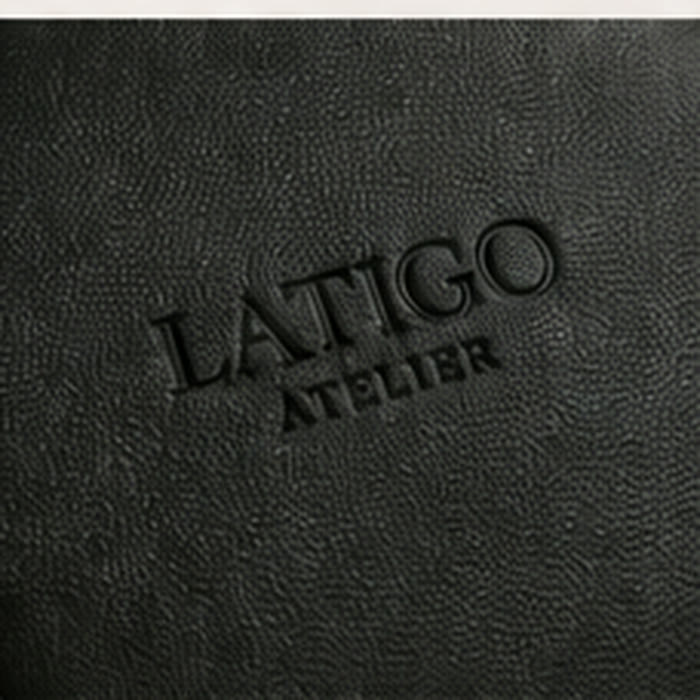 Embossed Latigo Atelier mark on onyx black vegan leather