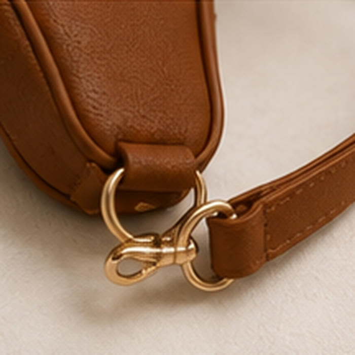 Adjustable strap and gold buckle detail